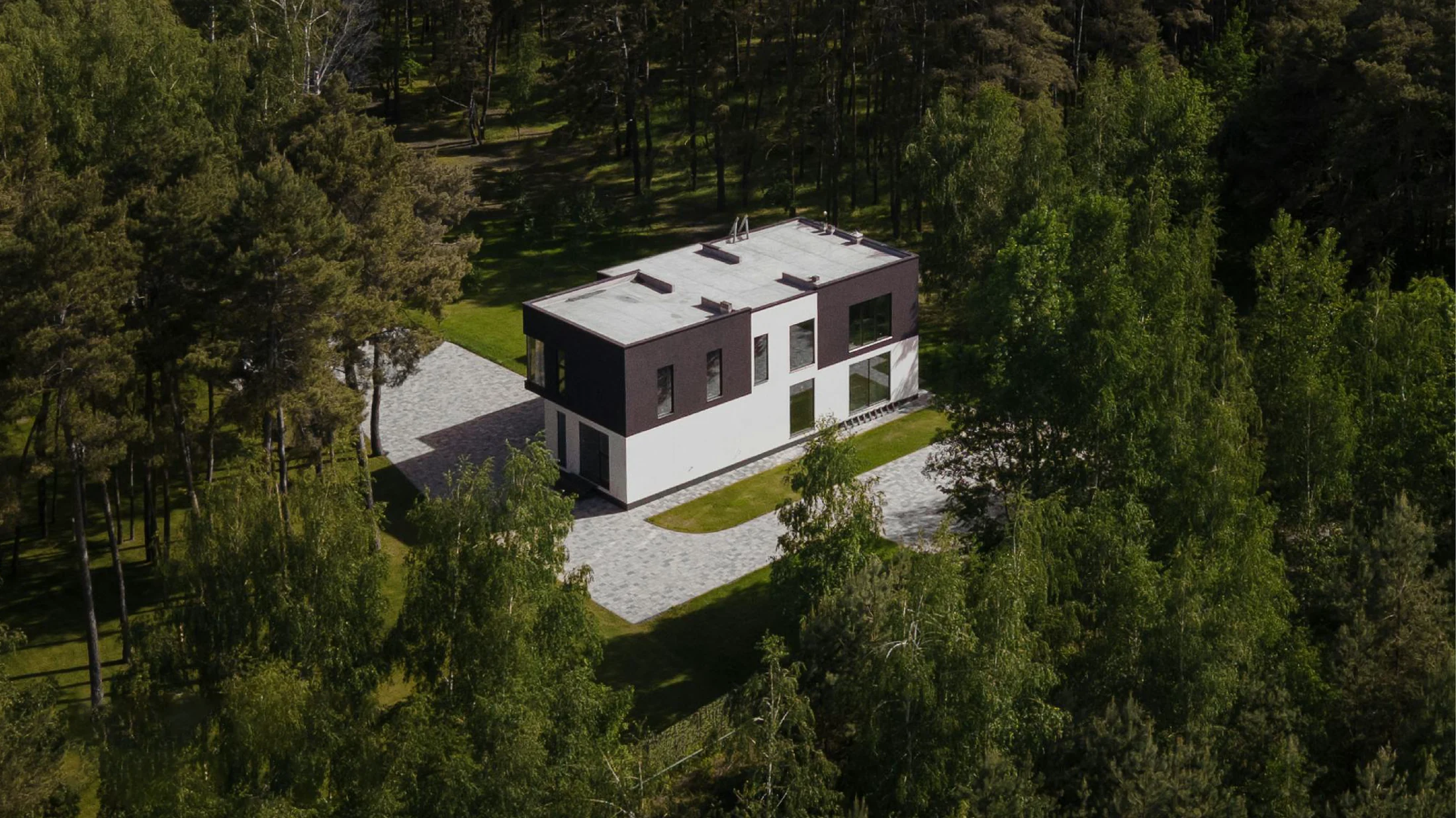 Modern building set among mature trees